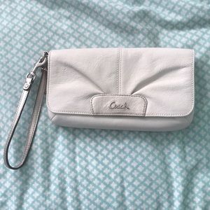 White and silver Coach wristlet wallet